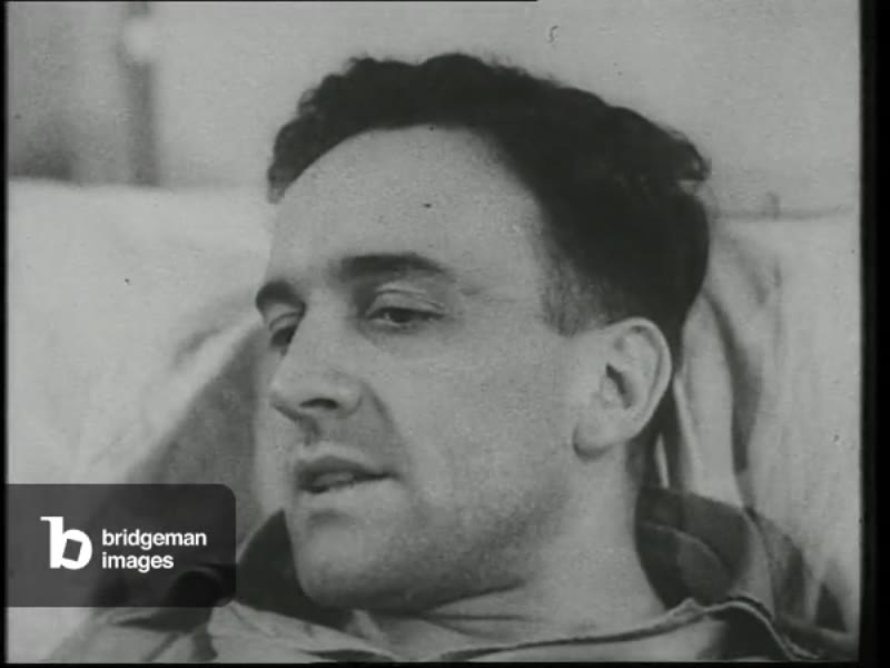 Image of Colonel Rudel interview from hospital bed, Germany, 1945