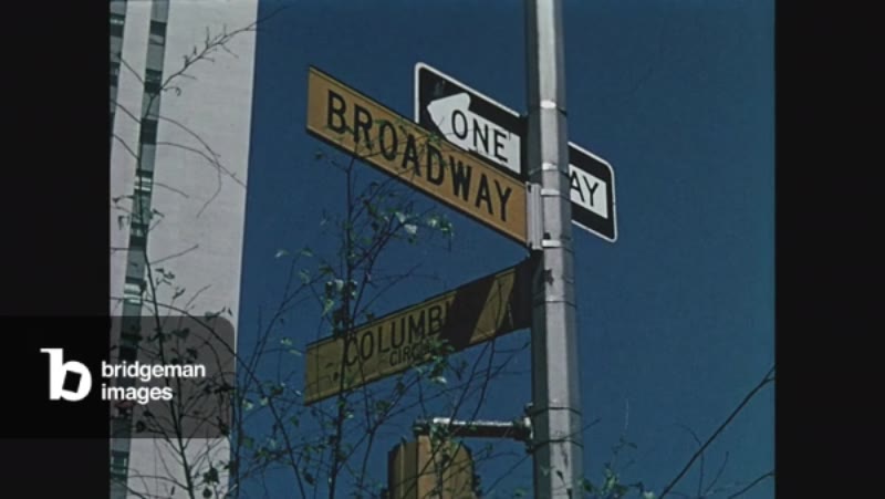 Image of Columbus Circle and Broadway street sign close up yellow sign,