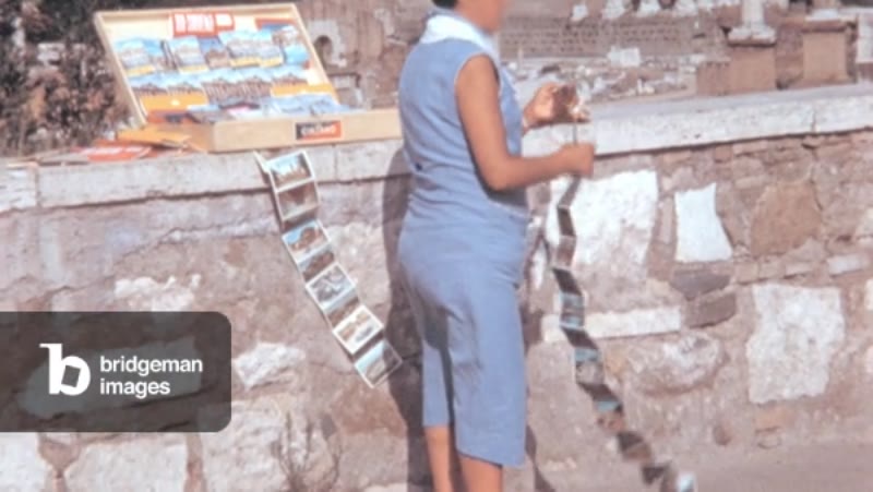 Image of Woman Sells Postcards and Souvenirs at the Rome Forum in